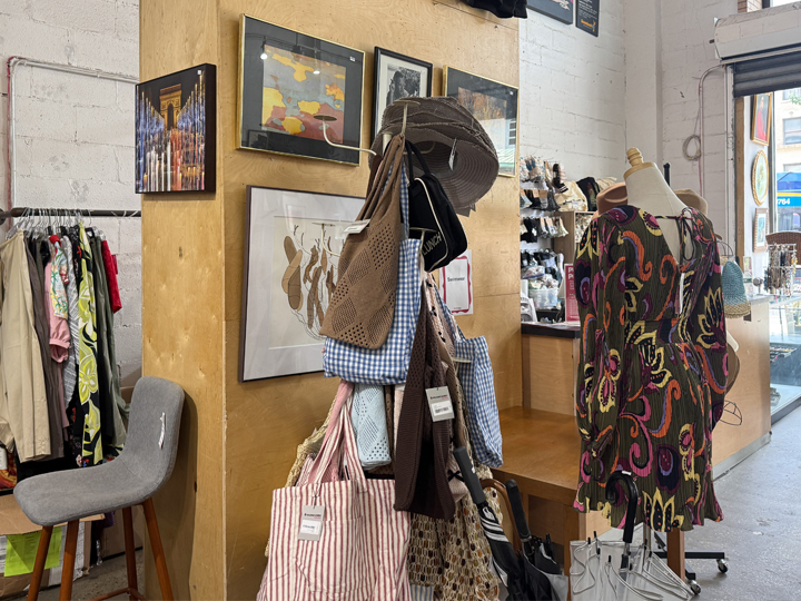 Secondhand tote bags, framed art, and women’s clothing at Housing Works Broadway and 96th Street