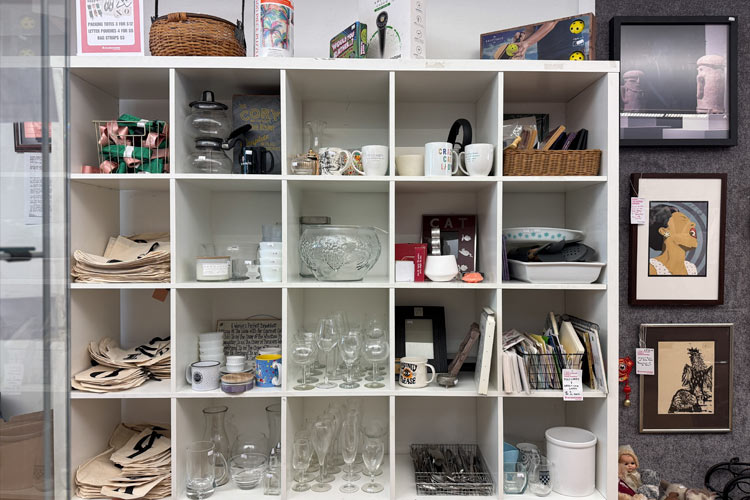 Secondhand glassware, dishes, books, and framed art at Housing Works Thrift Shop Brooklyn Heights