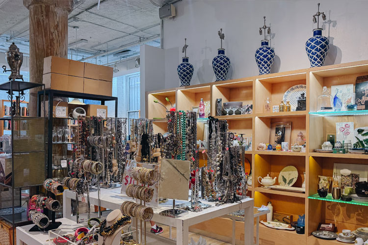 Displays of secondhand jewelry, ceramics, glassware, and decorative housewares at Housing Works Thrift Shop Chelsea.