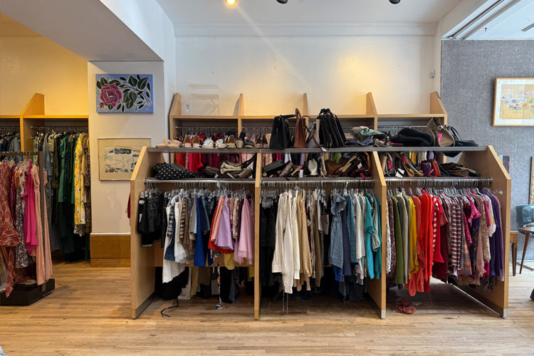 acks of secondhand women’s clothing, shoes, and handbags inside Housing Works Thrift Shop Columbus & 74th Street.