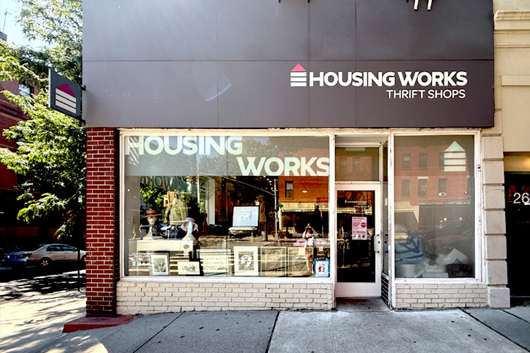 Housing Works Thrift Shop Park Slope storefront with a brick facade, display window, and entrance.